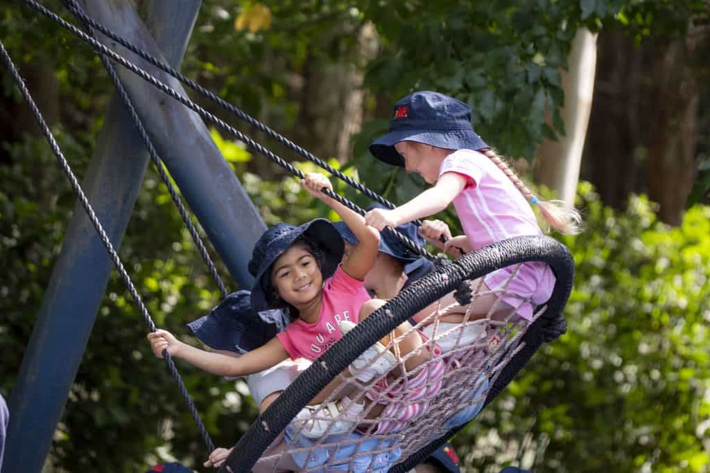Preschool children on swing at Fountaindale childcare within the Central Coast Region