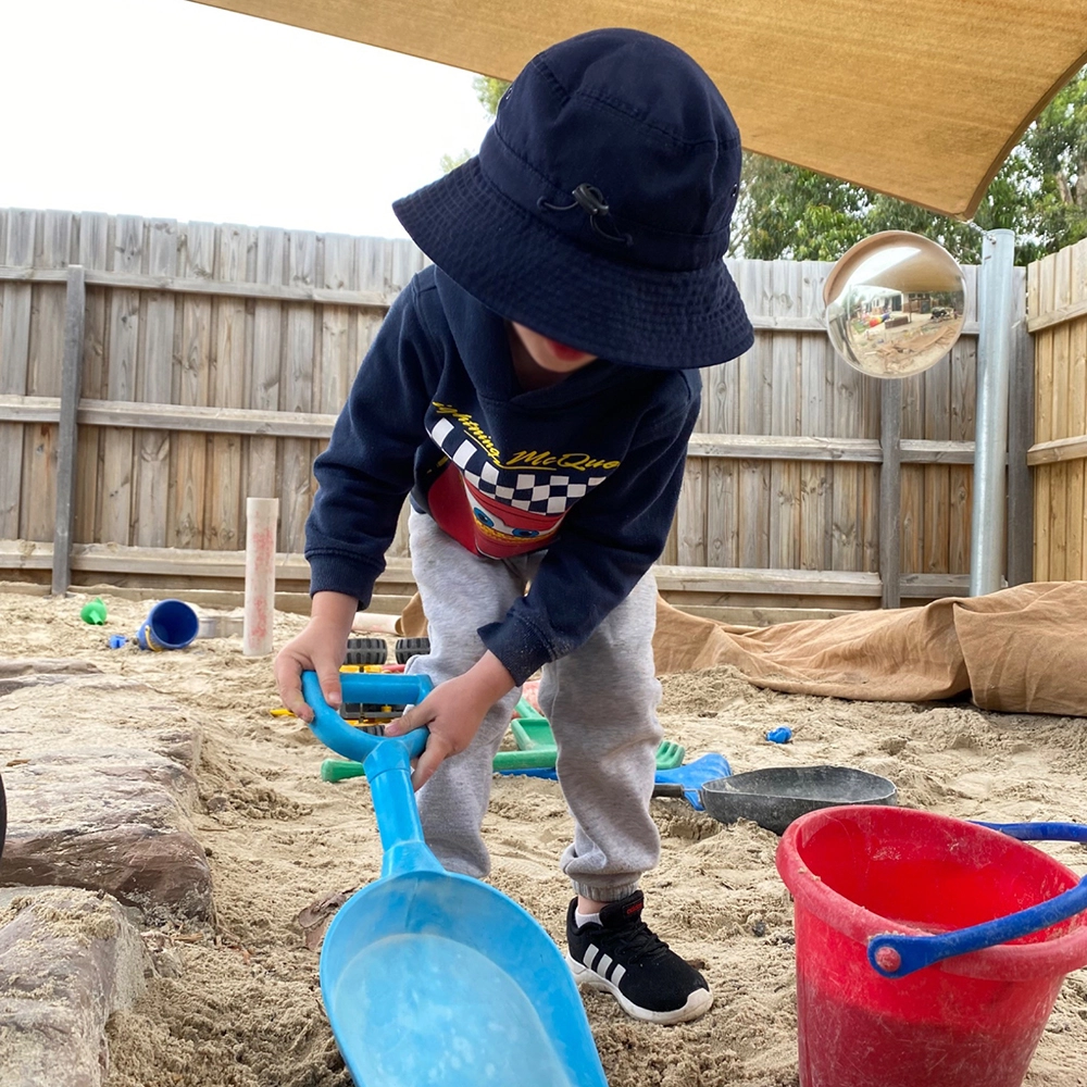 Child playing in sandpit at Lara preschool