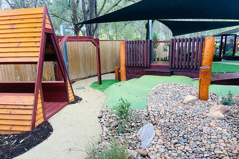 Triangle cubby house in outdoor playground at Pimpama childcare