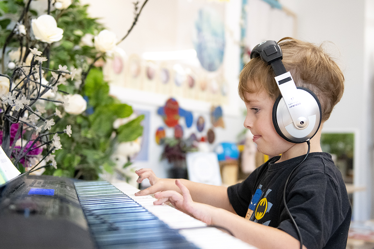 a child plays piano at Busy Bees at Maroochydore