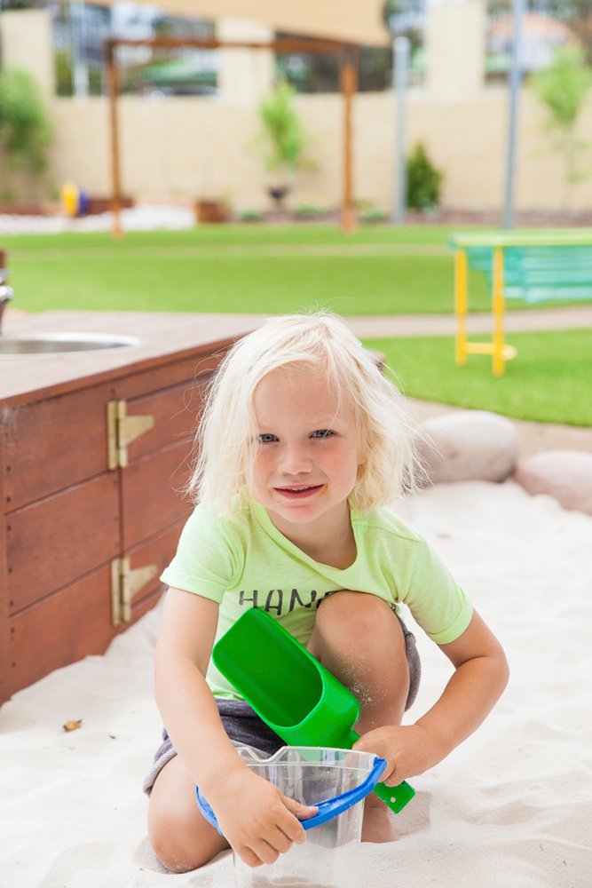 Child playing in sandpit