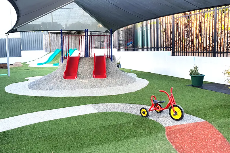 Slide and bike path at Busy Bees Early Learning located at New Lambton