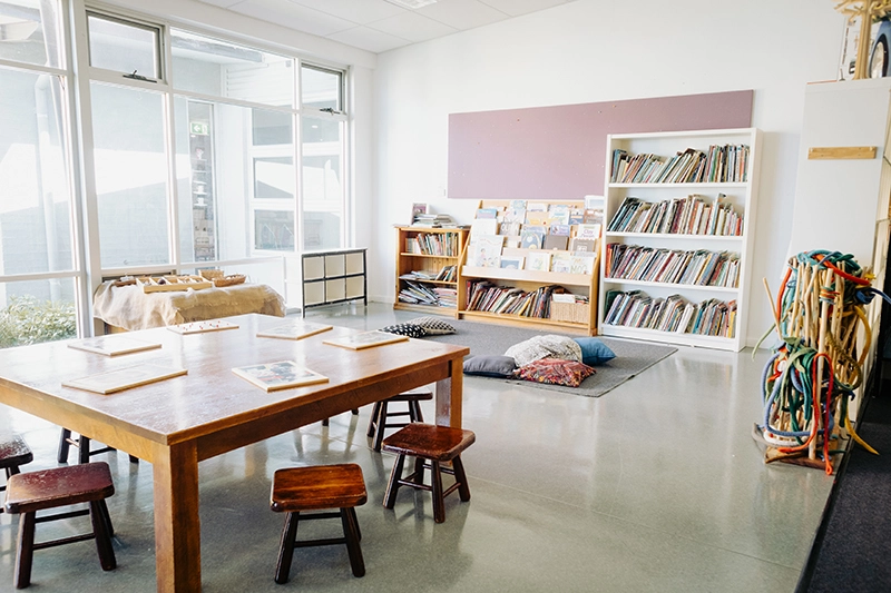 childcare classroom with table and library