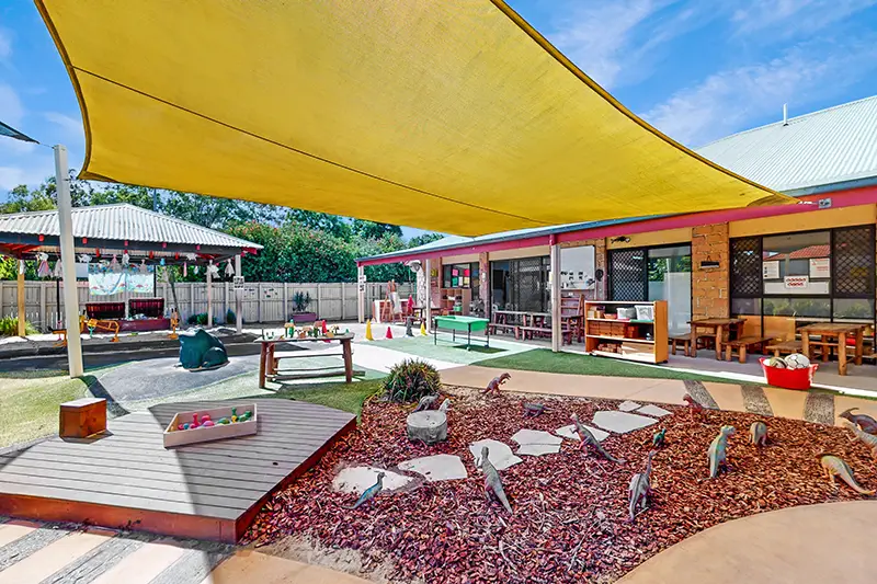 Shaded outdoor playground at Busy Bees Early Learning at Warner