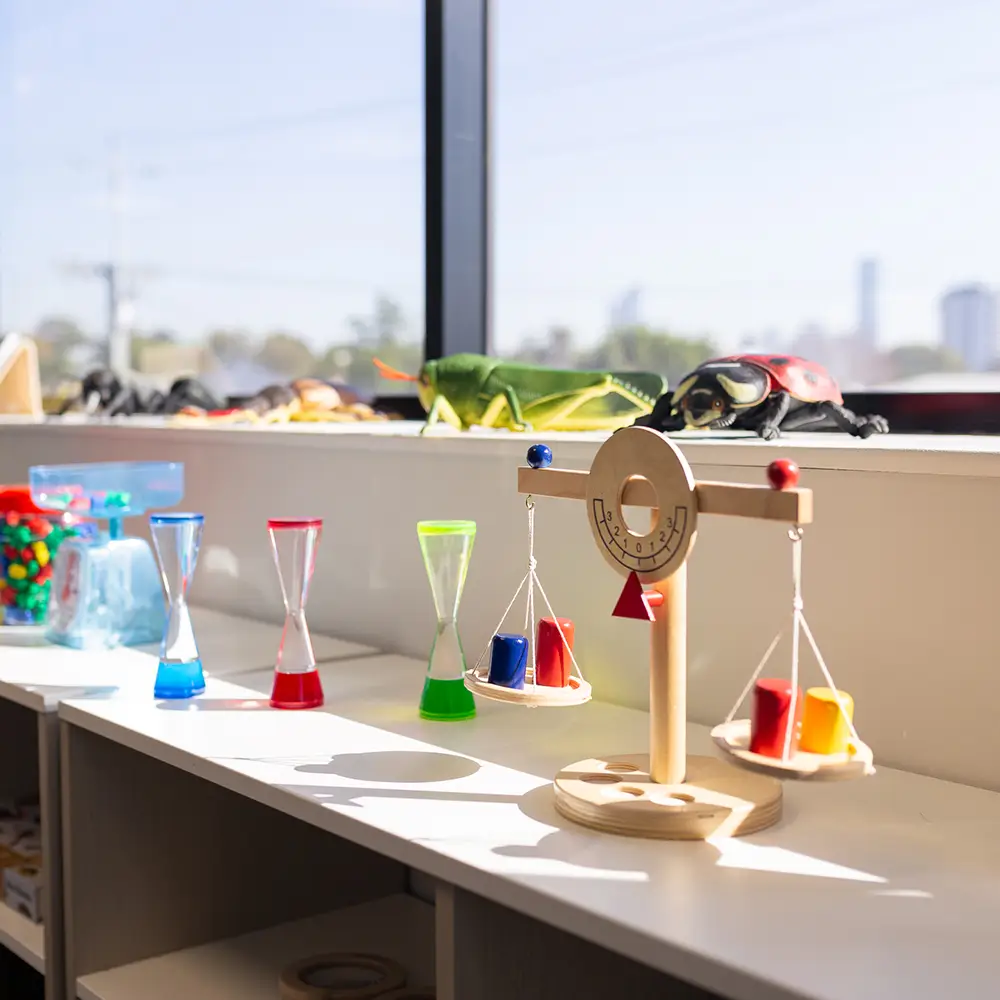 Measuring scales in front of window looking out at city views.