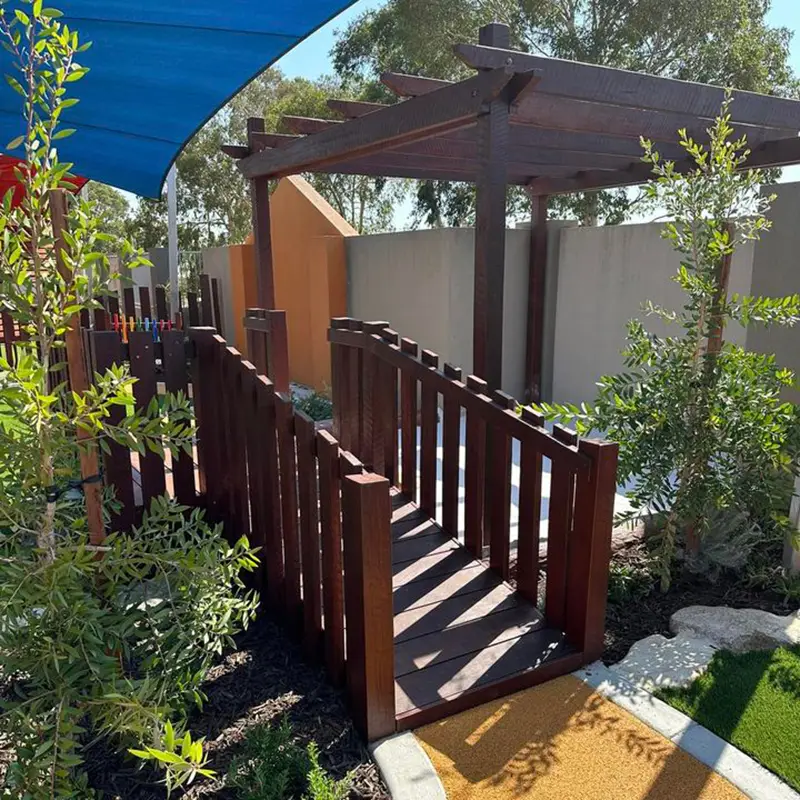 Wooden bridge in playground at Darch childcare centre