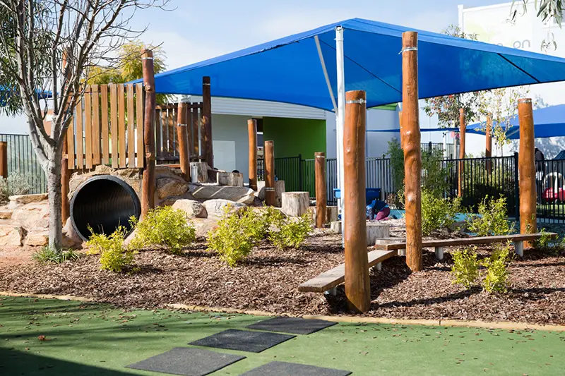 Playground with tunnel and balance beams at Mirrabooka daycare