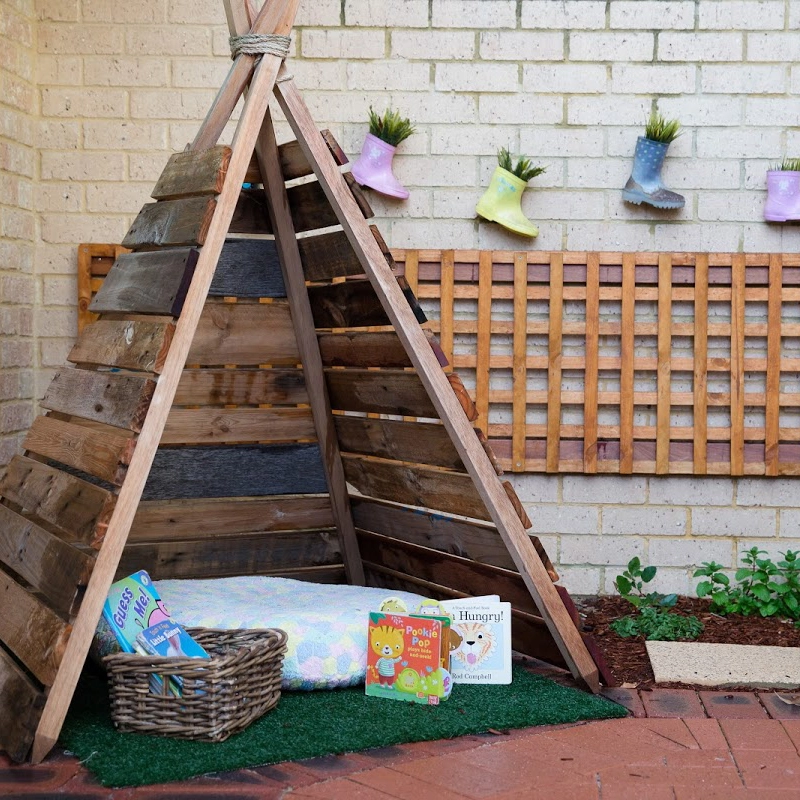 wooden teepee in nursery day care playground