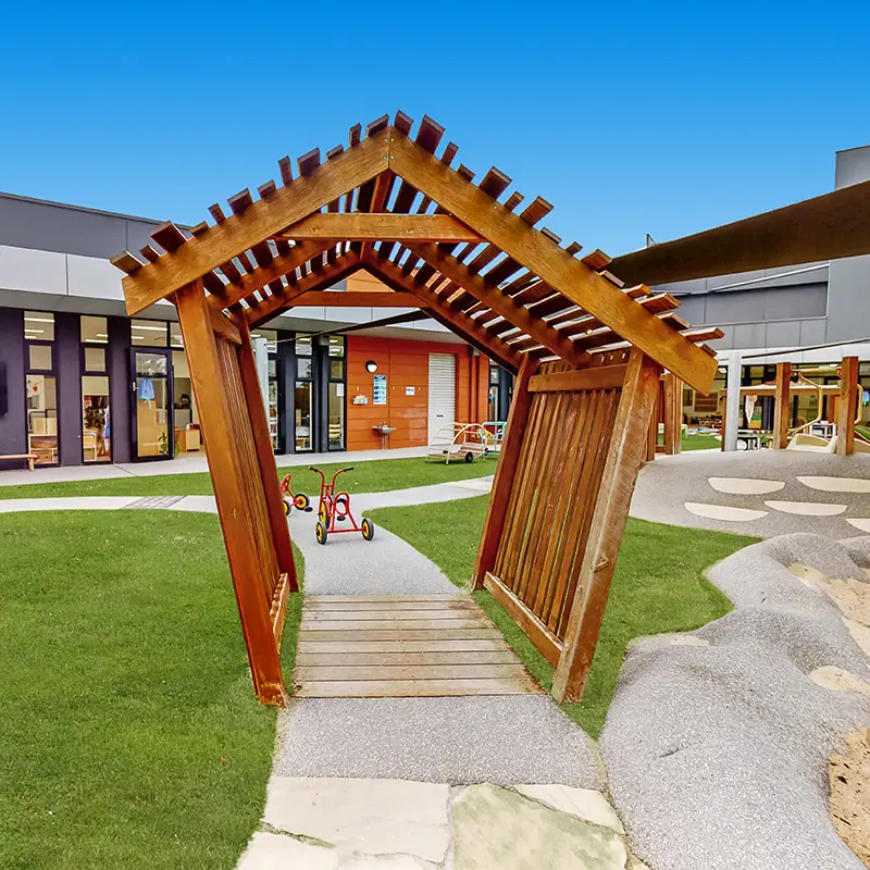 Wooden tunnel over bike track at childcare centre located in Cranbourne