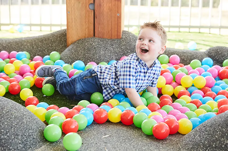 Toddler boy in ball pit at Killarney Heights childcare