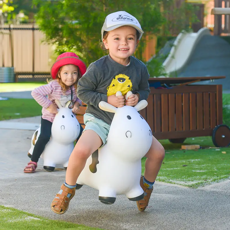 Children bouncing on ride-on toy