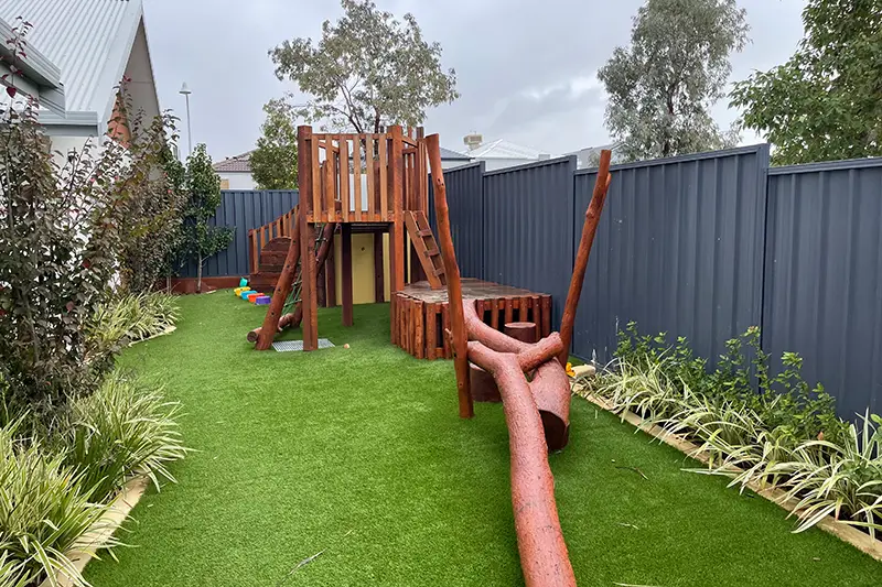 Wooden playground at Busy Bees Childcare centre located in Banksia Grove