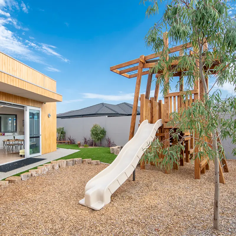 Timber fort with slide at Craigieburn childcare centre