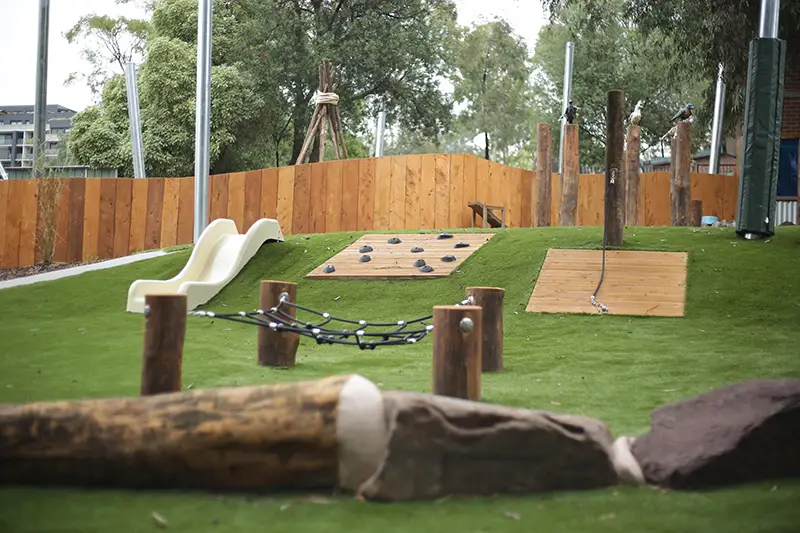 Playground with slide and climbing wall at childcare Doncaster East
