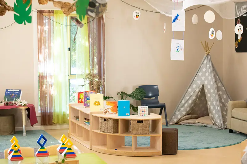 Childcare room with teepee and reading area