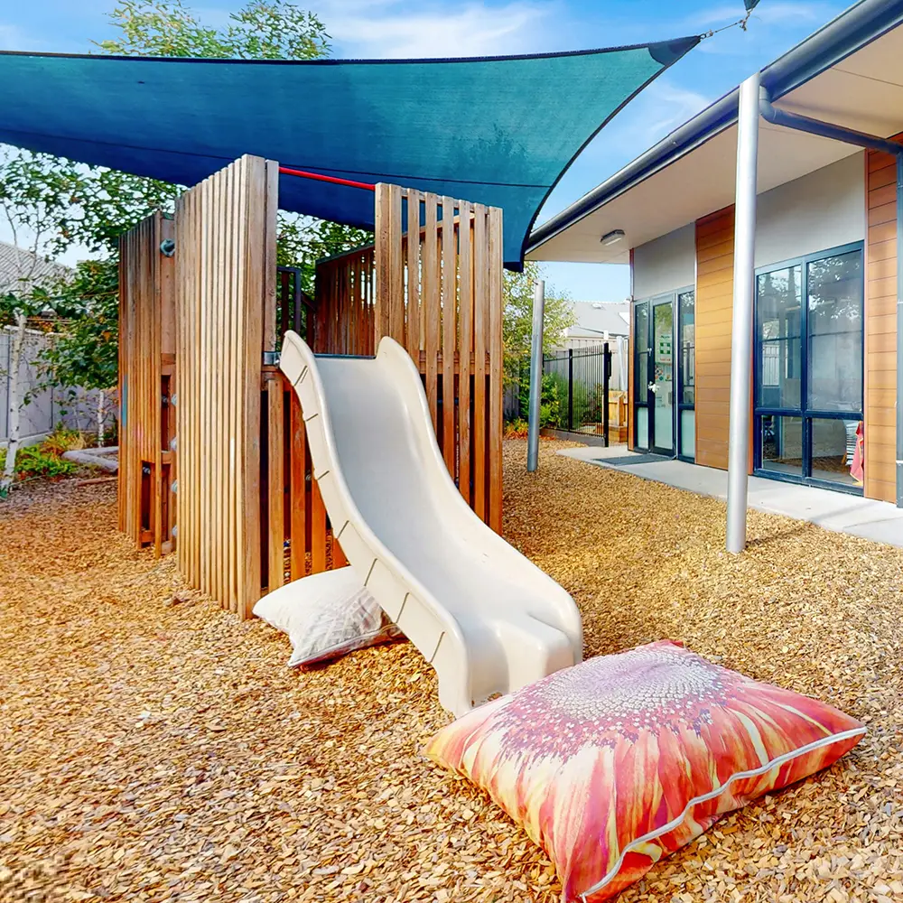 Timber fort with slide at Kilburn childcare centre