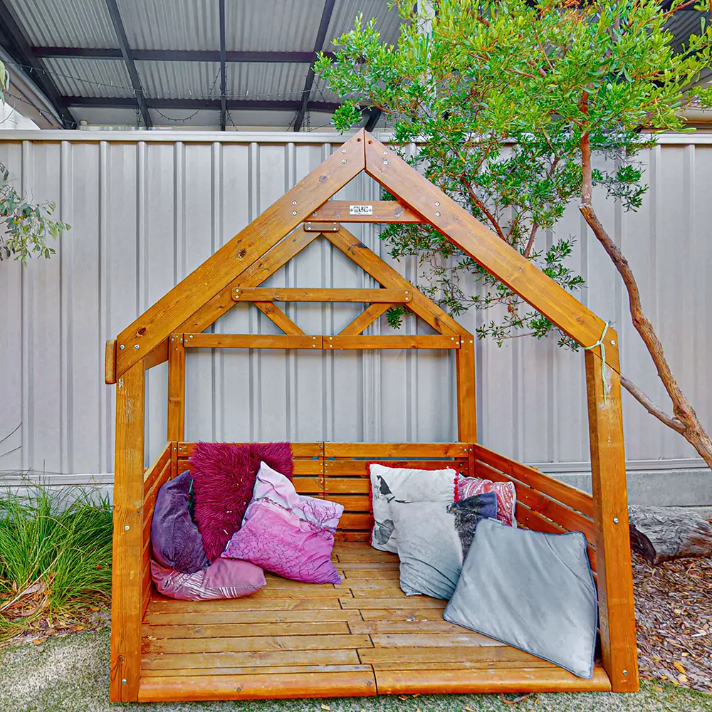 Cubby house in outdoor playground at Kilburn day care