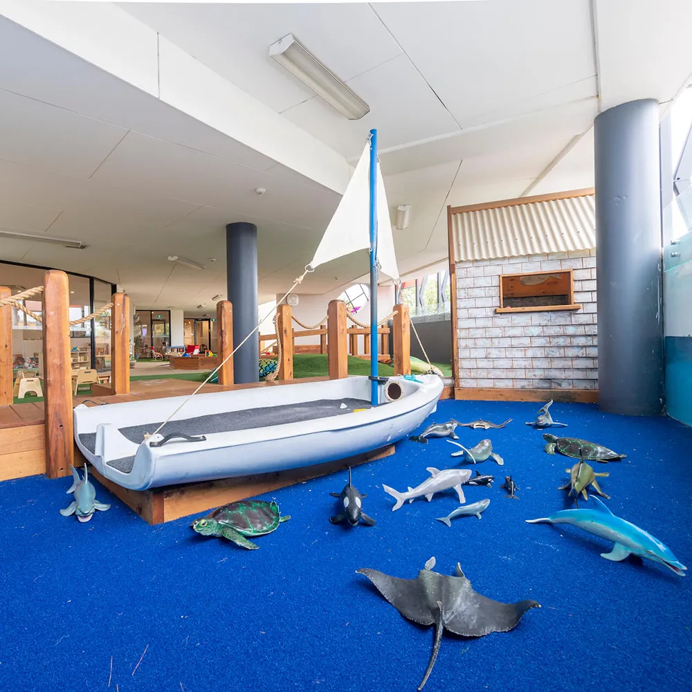 Undercover playground with boat and ocean toys