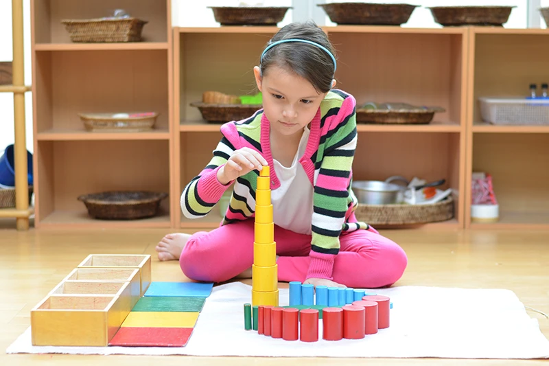 preschool girl with montessori counting blocks at Tingalpa childcare