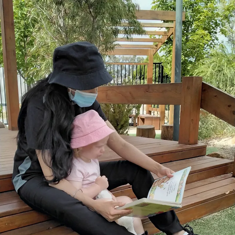 Early Childhood Educator reading to child