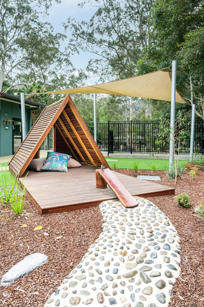 childcare playground with wooden tent