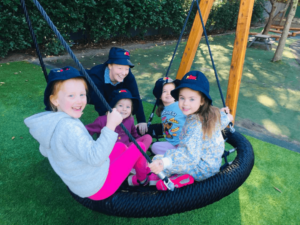 kids playing on a swing