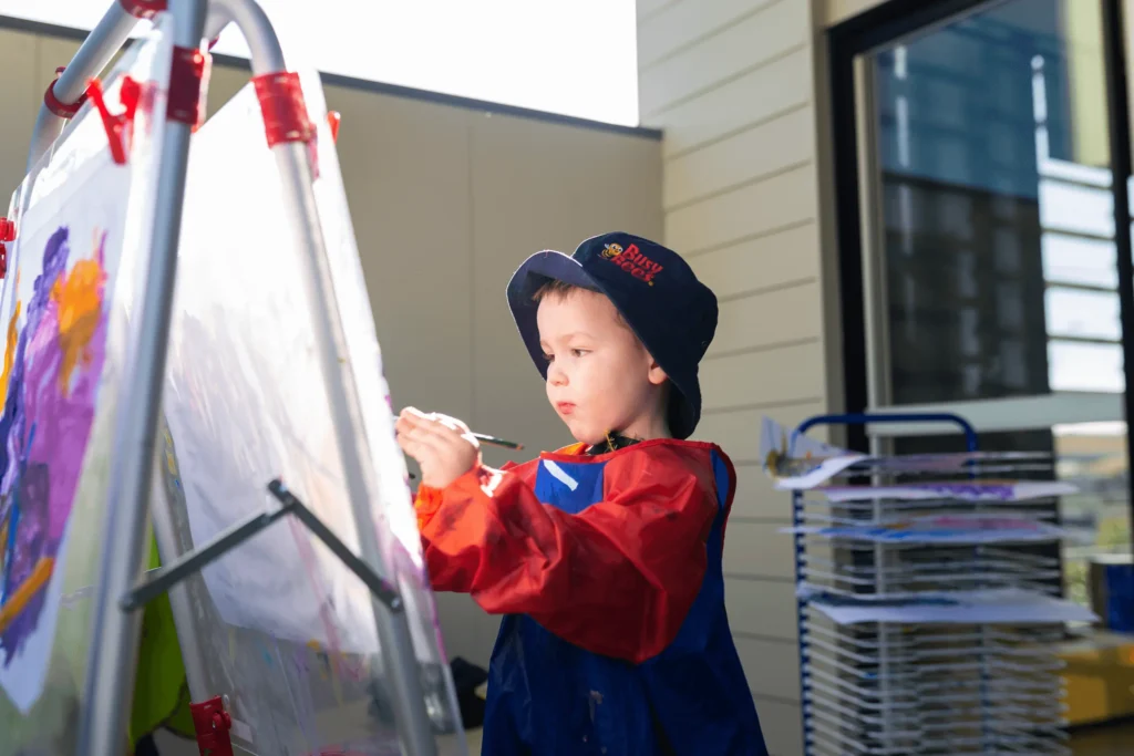 child painting on a canvas