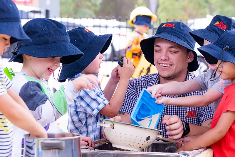 Male Early Childhood Educator with children