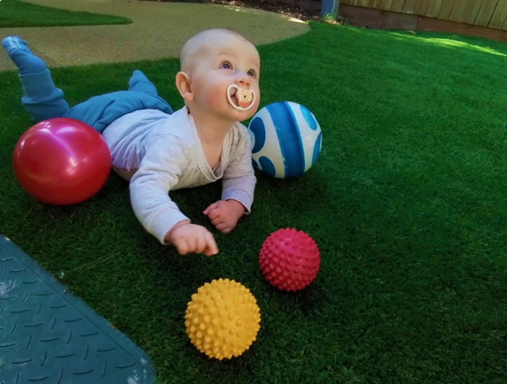 Baby with sensory ball