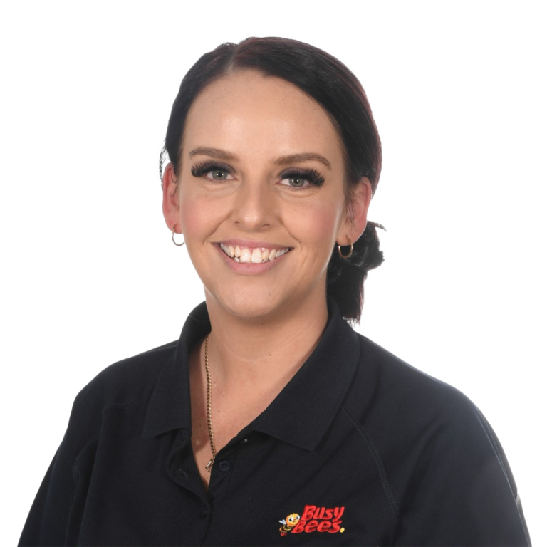 Jessica Chiementon, Assistant Manager of Busy Bees Burpengary East smiling at the camera, wearing a black collared shirt with the "Busy Bees" logo on it.
