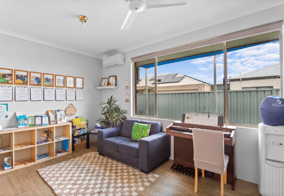 Quiet learning or family space with comfortable seating and educational resources.