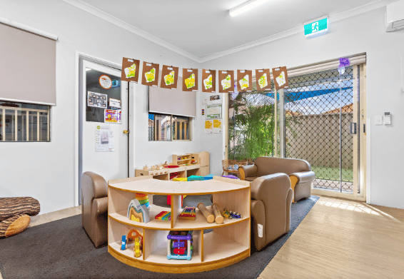 Learning area with reading corner, educational resources and natural light.