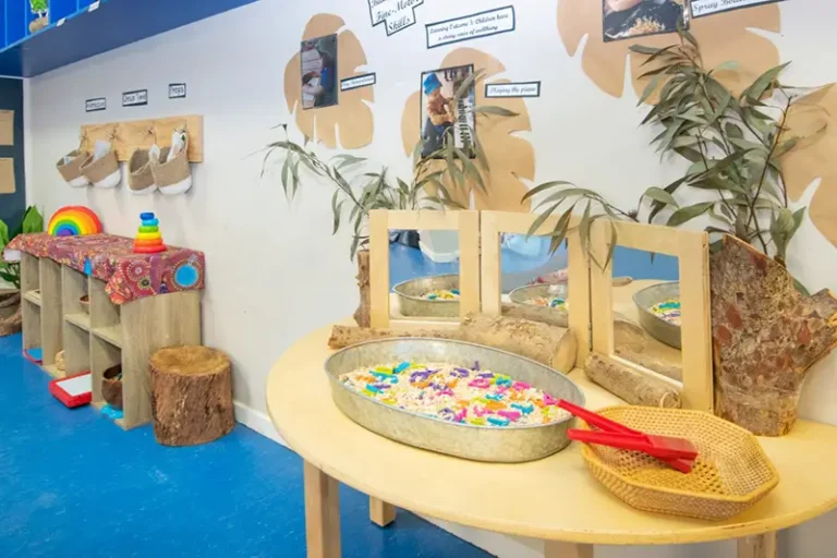 Literacy sensory tray activity in childcare room