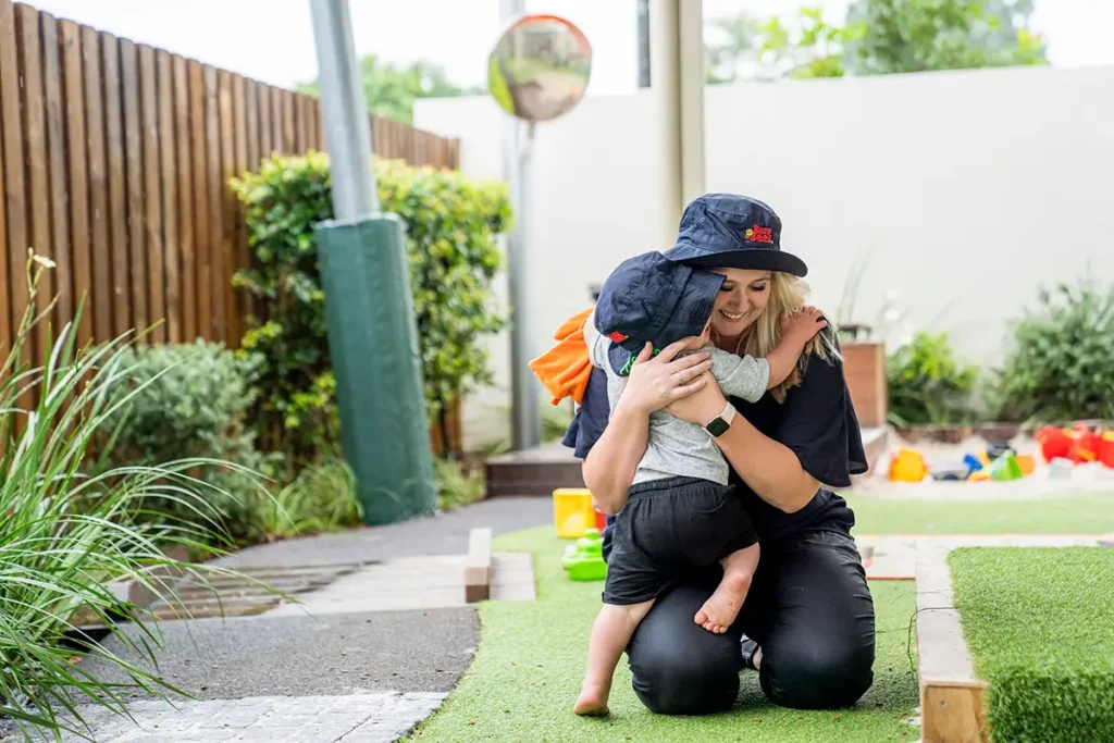 Child hugging Early Childhood Educator at Bellmere childcare