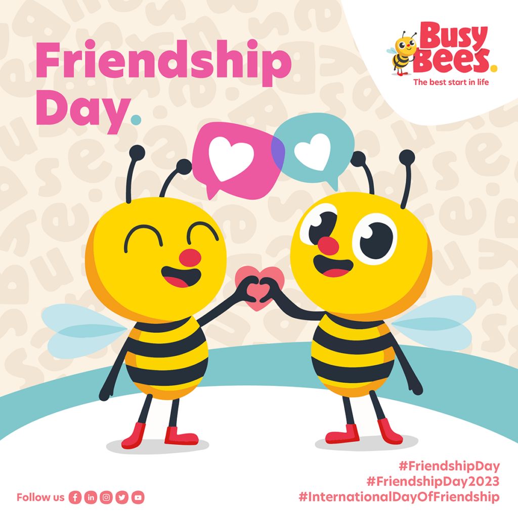 Two cartoon bees with heart icons above them hold hands. Text: "Friendship Day" and hashtags "#FriendshipDay," "#FriendshipDay2023," "#InternationalDayOfFriendship." Busy Bees logo is in the top right.
