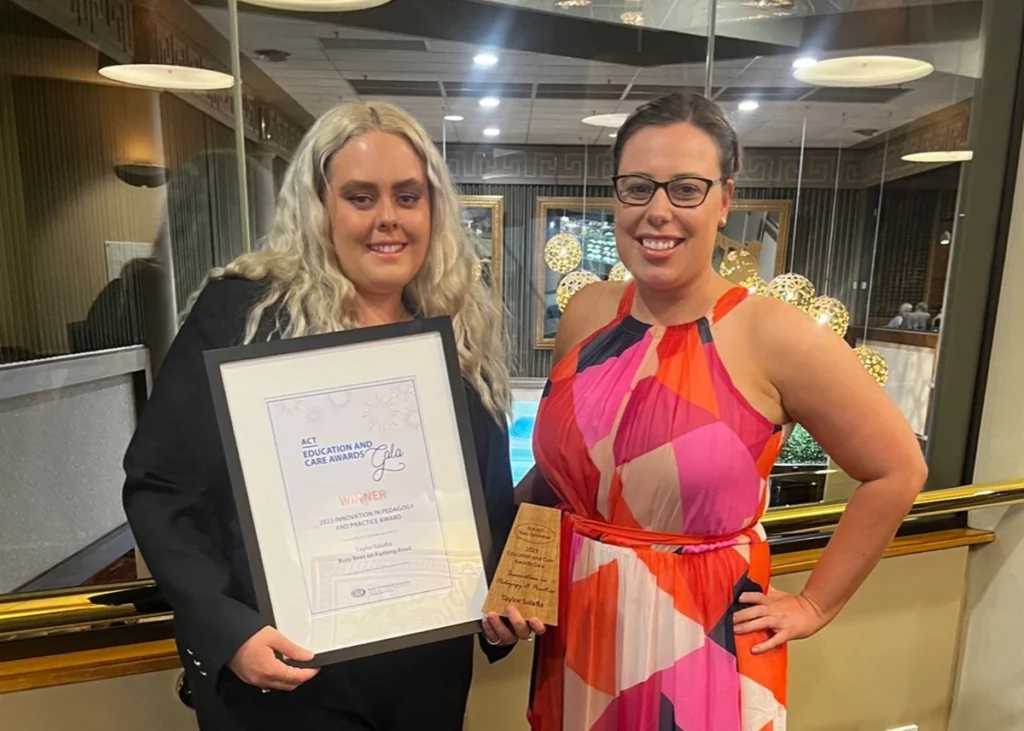 Childcare Manager of Busy Bees on Furlong Road holding an award