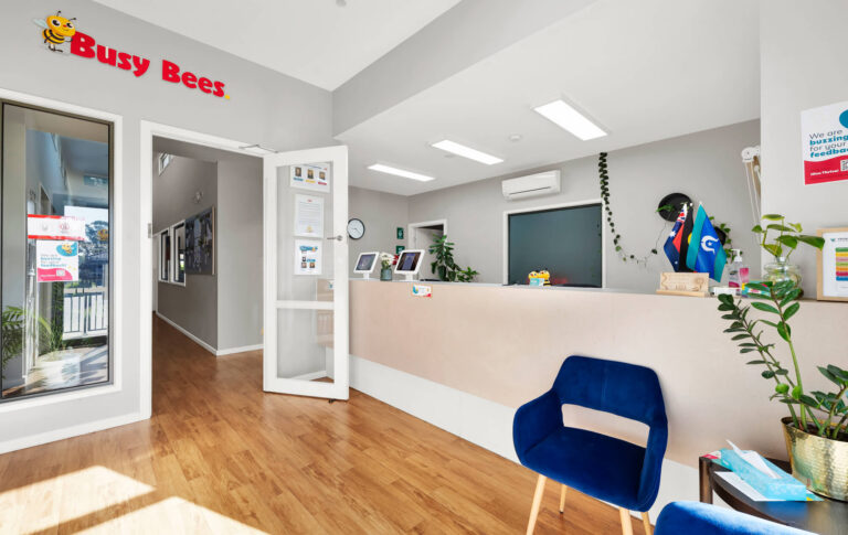 Reception at Busy Bees at Moonee Valley with sign-in tablets and a waiting area